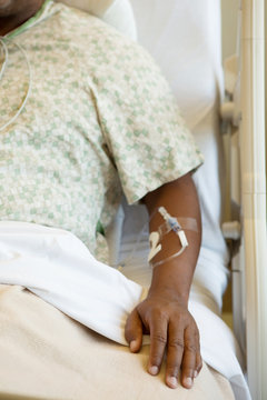 African American man in a hospital bed.