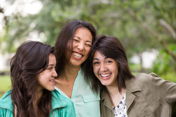 Beautiful Mother and Daughters - obrazy, fototapety, plakaty