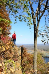 Man Standing on a Cliff Above the Mississippi River