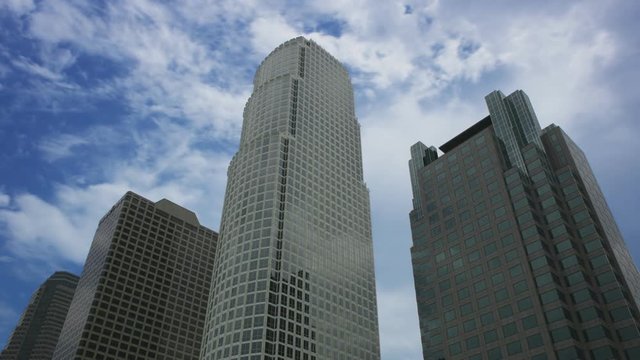 Time lapse of clouds behind skyscrapers in downtown Los Angeles.