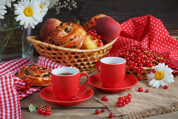 Fresh baked buns with a cup of coffee