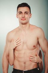 Fototapeta premium Sexy couple. Woman hands embracing half naked man.