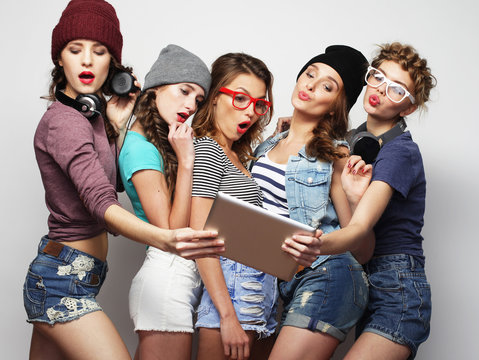 five hipster girls friends taking selfie with digital tablet