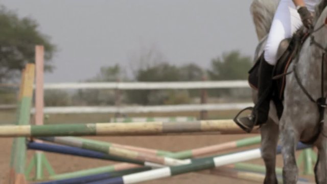 Girl jumping on a horse