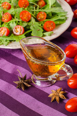 Vegetable oil with herbs and spices in a saucepan.