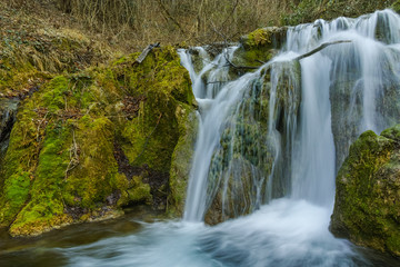 Fototapeta na wymiar Deep forest Waterfall near village of Bachkovo, Plovdiv region, Bulgaria