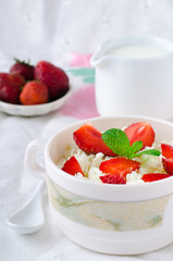 Breakfast with farmer cottage cheese, strawberries and mint