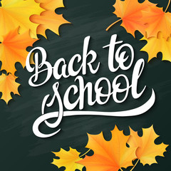 vector hand lettering greeting text - back to school - with realistic maple leafs on blackboard background