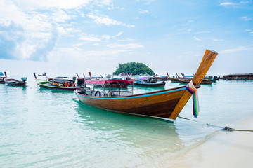 Sea beach with group long tail boat anchor coast at lipe island