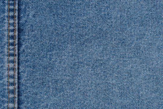 Denim jeans texture or denim jeans background with seam of fashi