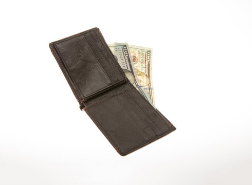 Money and wallet on the white isolated background.