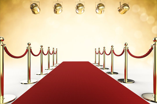 red carpet and rope barrier with shining spotlights