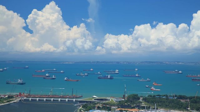 Time Lapse of cargo ships anchored of the coast of Singapore.