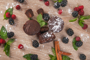 fondant fresh berries and mint on a blackboard