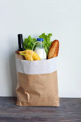 Big brown bag full of food products. Concept of healthy eating and eco friendly packing.