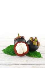 Mangosteen on White Wooden Background