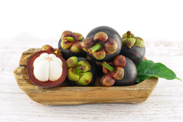 Mangosteen on White Wooden Background