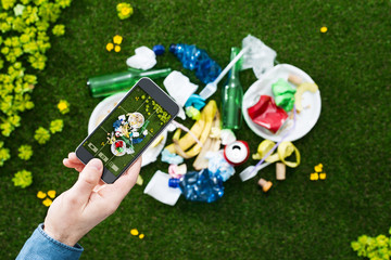 Man taking a picture of garbage