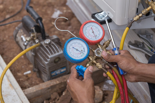 Vacuum Pump Evacuates Air From The Air Conditioner