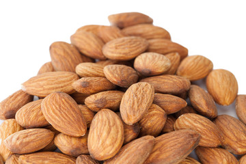 Dried almonds with almond blossom, isolated on white background