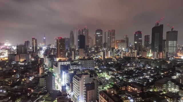 Time Lapse of nighttime clouds flowing over Shinjuku, one of the wards of Tokyo Japan.