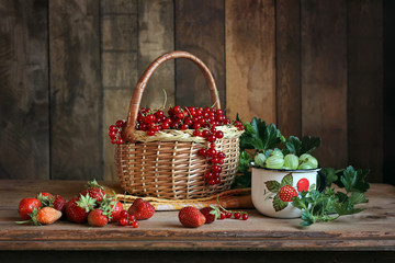 Fototapeta na wymiar Still life with berries. Red currant, gooseberry, strawberry.