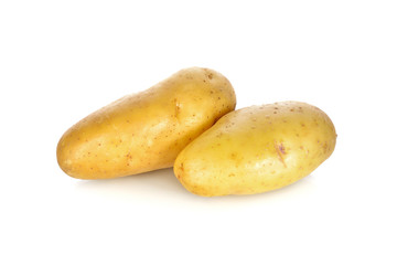 whole unpeeled fresh potato on white background