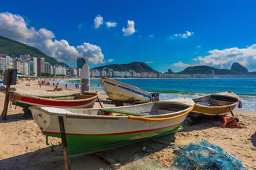 Naklejka na ściany i meble Boats on Copacacabana beach in Rio de Janeiro, Brazil. Copacabana beach is the most famous beach of Rio de Janeiro, Brazil