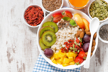 oatmeal porridge with fresh fruit and superfoods 