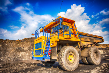 Big yellow mining truck at worksite
