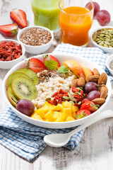 oatmeal porridge with fresh fruit and superfoods 