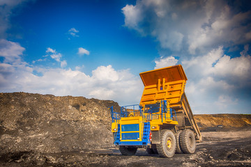 Big yellow mining truck at worksite
