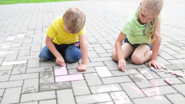 kids painting with chalk