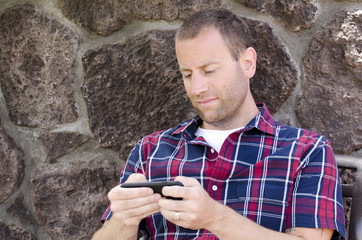 Man on a smartphone playing pokemon go.