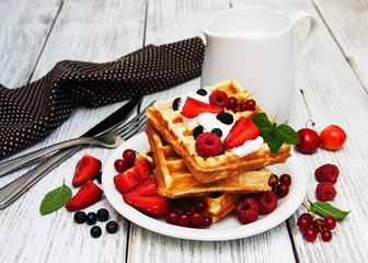 waffles with strawberries,  blueberry and milk