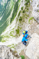 Fototapeta premium Hiker climbing in the mountain of Alps, Europe