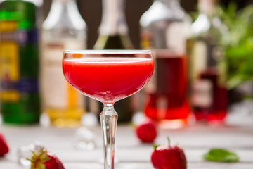 Glass with red cocktail. Liquid of bright color. New recipe of festive drink. Clover club tastes delicious.