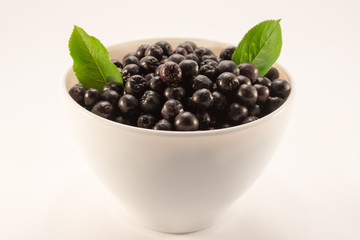 White bowl with aronia
