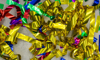 Yellow festive confetti on the grey floor
