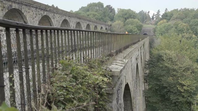 Scenic shot of the world famous Chirk Aqueduct built in 1801 by Thomas Telford. This impressive canal aqueduct has a bigger brother by the side for rail transportation. Located on the Llangollen Canal