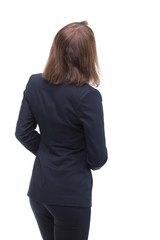 Young businesswoman looking at something. Back view