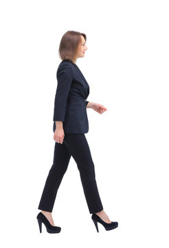 Full-length Profile Of Walking Businesswoman, Isolated On White