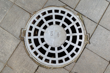 Perforated metal cover of the hatch covering the technology pit