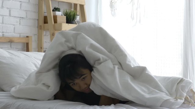 4K : Happy Asian family, Daughter playing hide and seek with father on the bed