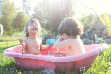 kids in bath water outdoor