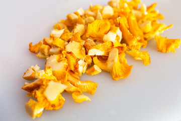 Sliced golden chanterelle fungus on the cutting board