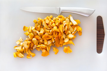 Sliced golden chanterelle fungus on the cutting board