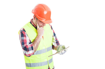 Constructor with modern tablet thinking at something