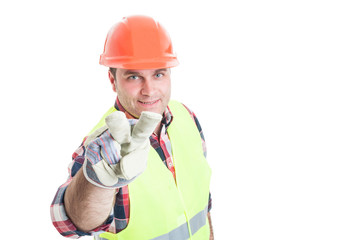 Male constructor making watching you hand gesture