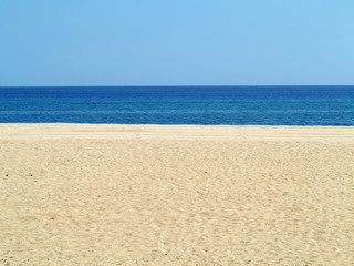 Fototapeta na wymiar Empty sea and sand beach background on Costa Brava, Spain